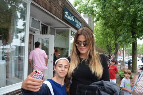 Khloé Kardashian poses with a fan.