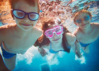 Kids swimming underwater