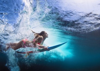 Surfer girl underwater