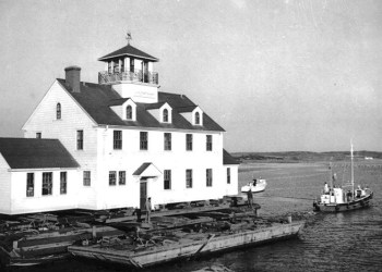 Towing the Coast Guard station, March, 1955