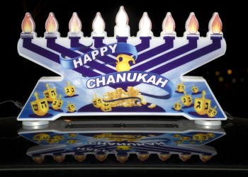 A lighted menorah atop one of the cars in the MenorahCade