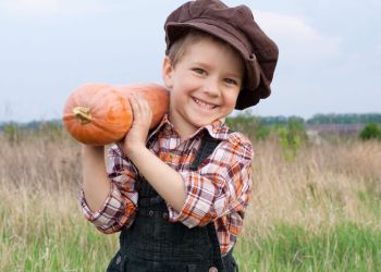 kid with pumpkin