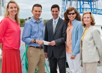 Peconic Baykeeper Board members Maureen Sherry, Dan Guilizio, Nancy Hébert and Phyllis Toohey, present Dr. Christopher Gobler with a grant for a dedicated shellfish spawner sanctuary.