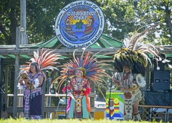 Under the shield of the Shinnecock Nation, Aztec performers play drums, flutes, conch and sing in a special opening performance depicting folklore stories.