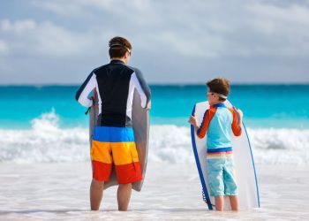 father and son surfing