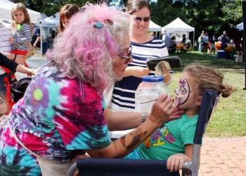 Mia Mastropierro gets her face painted at Fancy Faces by Kathy