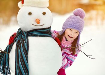 little girl with snowman