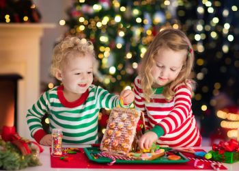 kids making gingerbread house