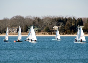 Boats from the Breakwater Yacht Club dotted the bright blue icy water beyond the wharf of HarborFrost 2016