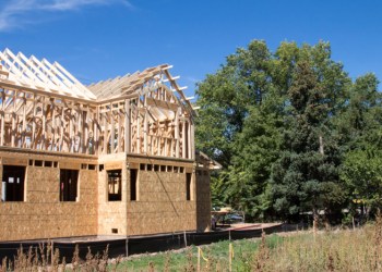 House construction next to trees