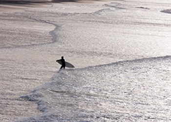 Surfer at end of day