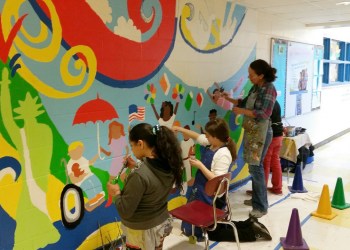 Joyce Raimondo paints mural at East Hampton school