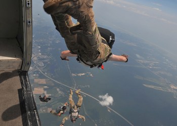 Members of the 103rd Rescue Squadron conduct canopy control training at Calverton Airport