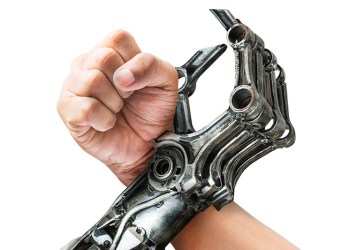 human arm and robot arm crossed