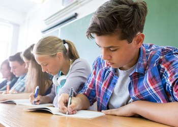 Group of students takes the test in class, Photo: Yanlev/123RF