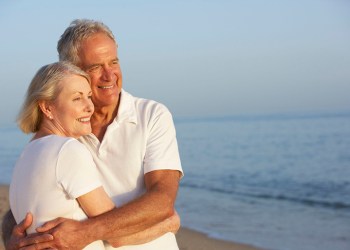 42400380 - senior couple enjoying beach holiday