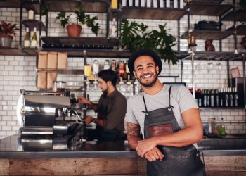 Restaurant coffee shop owner in front of counter