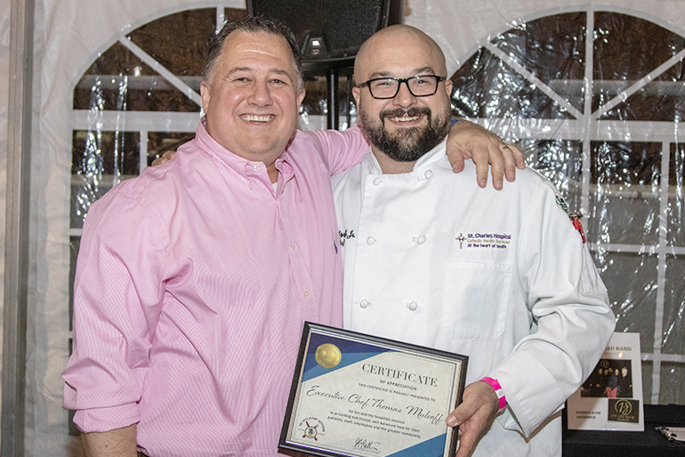 Dan's Papers President and Editorial Director Eric Feil congratulates St. Charles Executive Chef Thomas Mulzoff on his award, Photo: Barbara Lassen