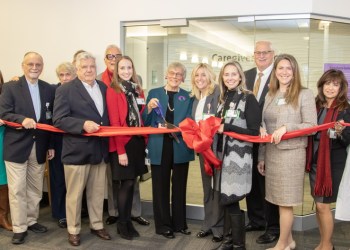 The ceremonial red ribbon was cut to officially announce the opening of the new Caregiver Center