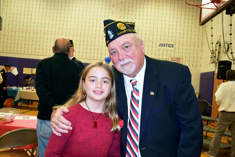 Veteran John Lenihan with his granddaughter, Kiarra O’Hagan, a fourth-grader at Hampton Bays Elementary