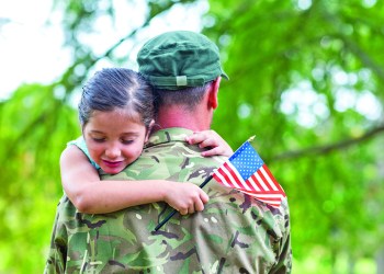 Soldier reunited with his daughter on a sunny day