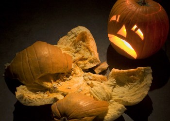 Smashed pumpkin and frowning jack-o-lantern