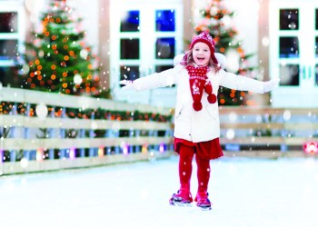 Kids ice skating in winter park rink. Children ice skate on Christmas fair. Little girl with skates on cold snowy day. Snow outdoor fun for child. Winter sports. Xmas vacation activity with kid.