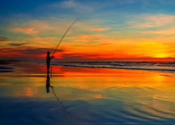 Surfcaster at sunset