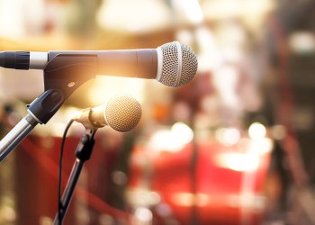 Microphone on concert stage background