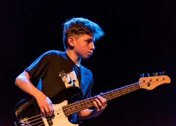 East End Arts Summer Camp boy with guitar