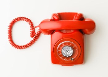 Hamptons Police Department red rotary phone with badge at center