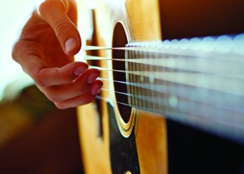 play acoustic guitar, close up of the hands