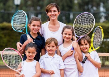 Group of young tennis players at the court