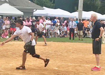 Bill Clinton umpires at the 2019 Artists & Writers Game