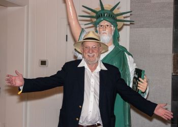 Dan Rattiner with statue