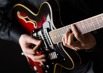 Man with guitar during concert