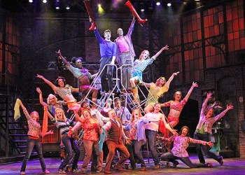 Charlie (Lukas Poost) and Lola (Terry Lavell) with the Kinky Boots company