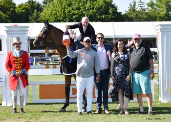 Mario Deslauriers, on Bardolina 2, celebrates his 2019 Hampton Classic Grand Prix victory with champagne