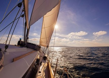 Sailing boat wide angle view in the sea, instagram toning