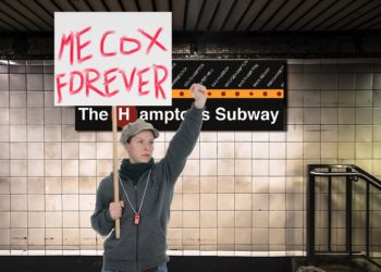 Demonstrators stood on the tracks waving signs that read MECOX FOREVER