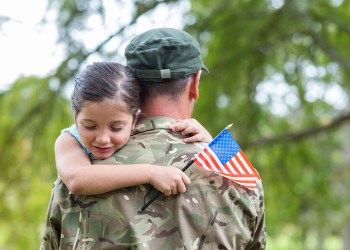 Soldier reunited with his daughter on a sunny day