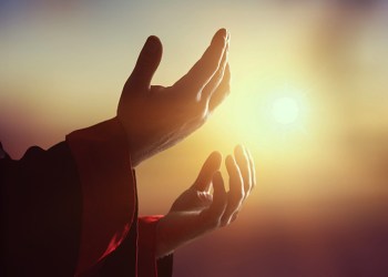 Silhouette human hands open palm up on sunset. Mercy, Humble, Repentance, Reconcile, Adoration, Glorify, Christmas, Redemption, Redeemer, Eucharist, Year 2016, Love, Jesus Christ, Blessed, God concept