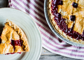 Homemade cherry pie on rustic background