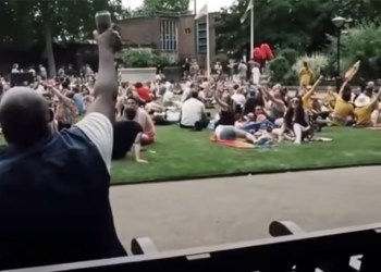 Man on park bench sings Bon Jovi's 