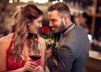 Man give rose to girlfriend in the Valentine’s evening