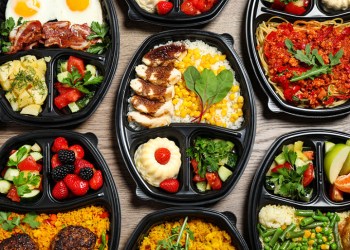 Good takeout Lunchboxes with different meals on table, flat lay. Healthy food delivery