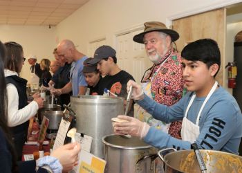 Volunteer Matthew serving up hot soup