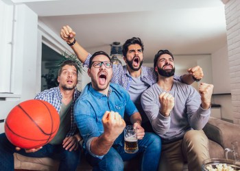 Guys watching basketball