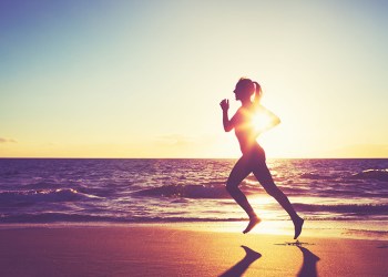 Woman Running on the Beach at Sunset