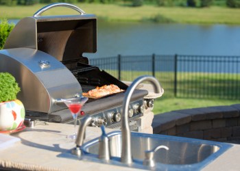 Cooking Cedar Salmon on the Barbecue at the Outdoor Kitchen